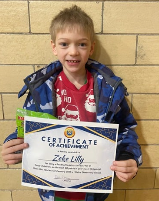 Student with awards for reading the most books