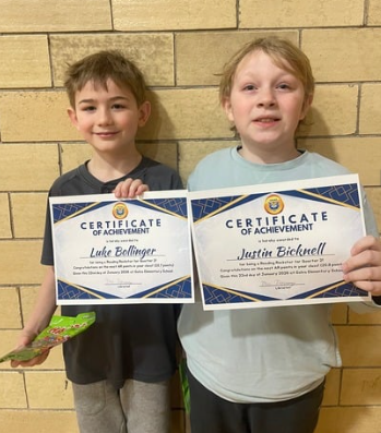 Student with awards for reading the most books