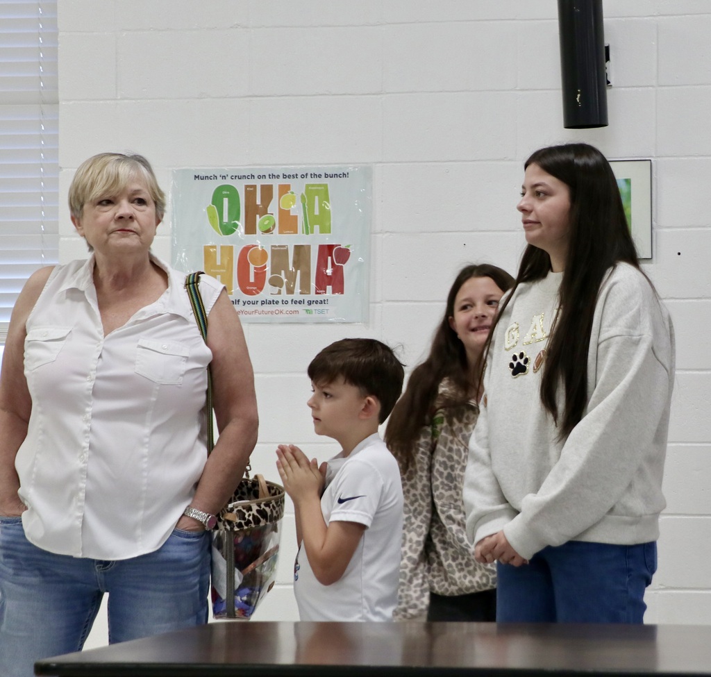 Students and family members gather in the school cafeteria for Grandparents’ Day.