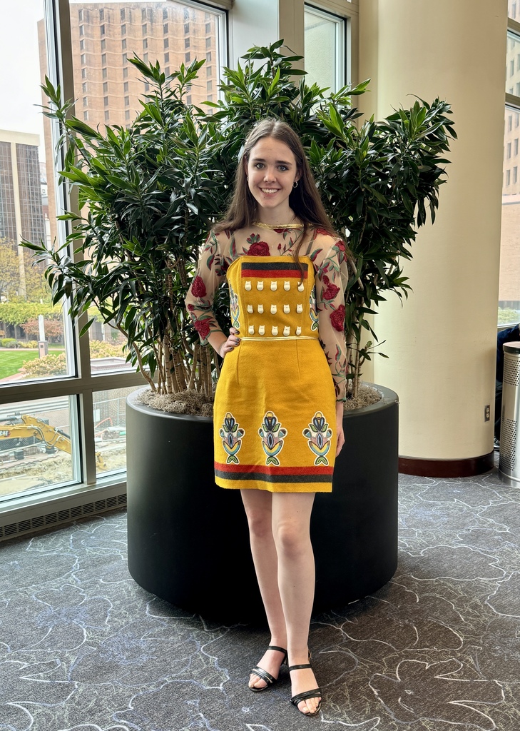 FFA member poses in a yellow native inspired dress, made by American Indian fashion designer Designs by Della, which was a part of the presentation given moments before.