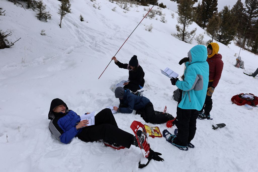 Students collecting data on snow