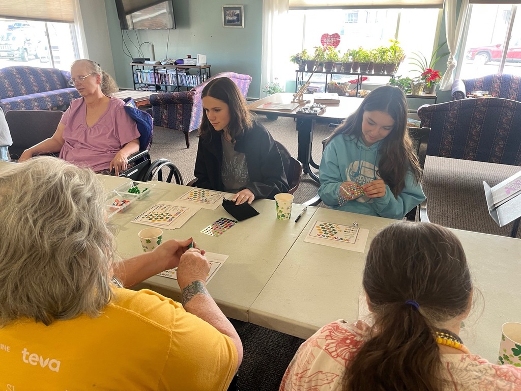 Aria and Hayden visiting with residents.