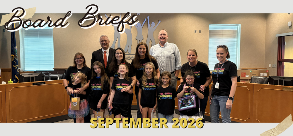board briefs September 2026 photo of students and teachers in black shirts with administrators in the board room 