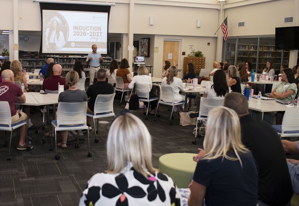 Superintendent Bertrando talks to a group of new teachers on their first day of orientation.