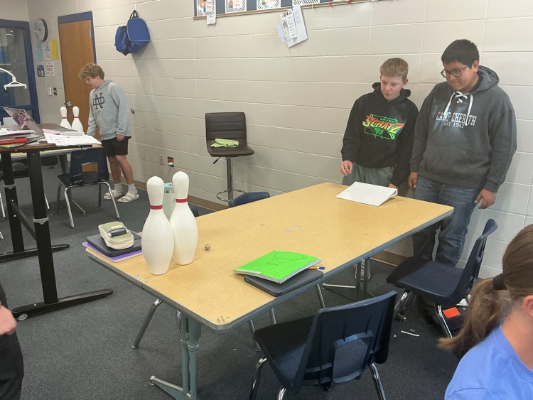 Carlos and Reilly learn about mass and velocity can knock down a bowling pin. Bo