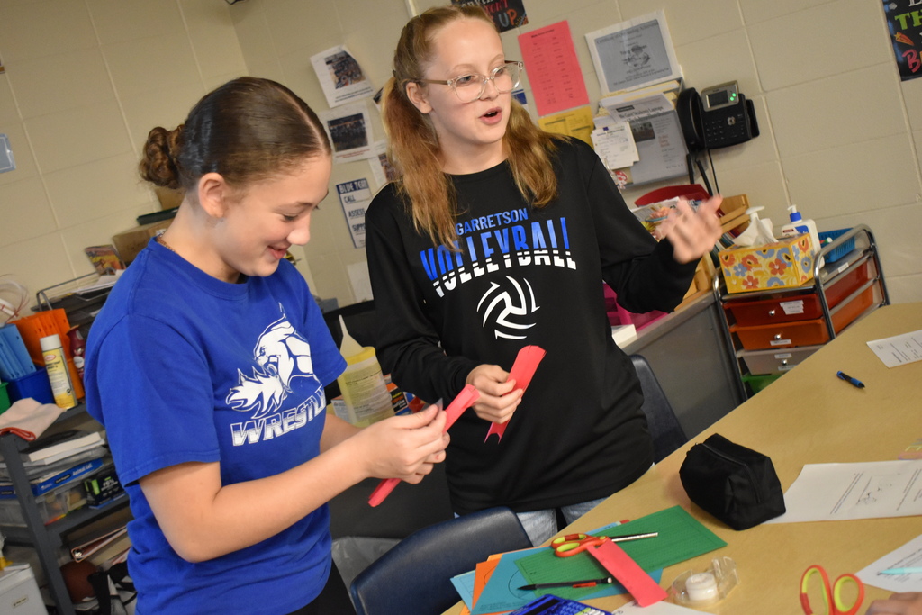 Eighth graders work in science class