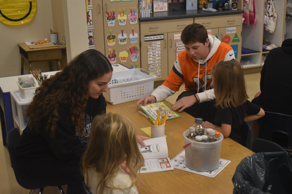 Seniors reading to Kindergarteners