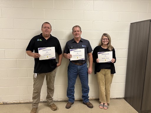 Image of Mr. Larry Carr, Mr. Tim DeWitt, and Mrs. Mindy Durst holding their years of service certificates.