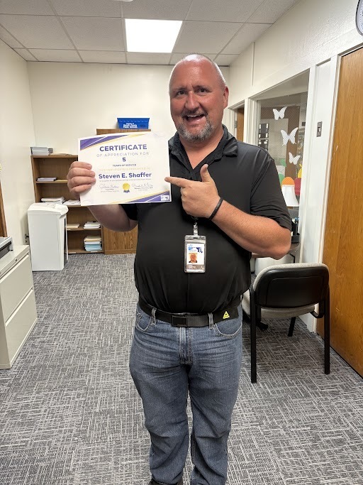 Image of Mr. Steve Shaffer holding his years of service certificate.