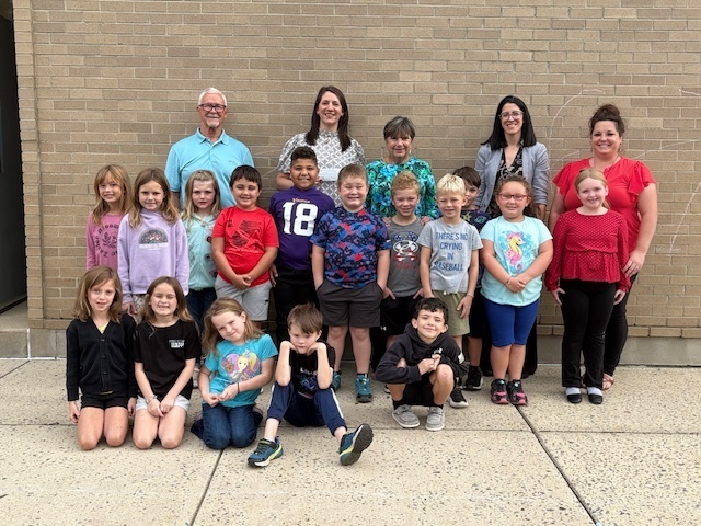 Image of Mrs. Witt, GCPS Administrators, Mr. & Mrs. Woods, and Mrs. Witt's students posed together.