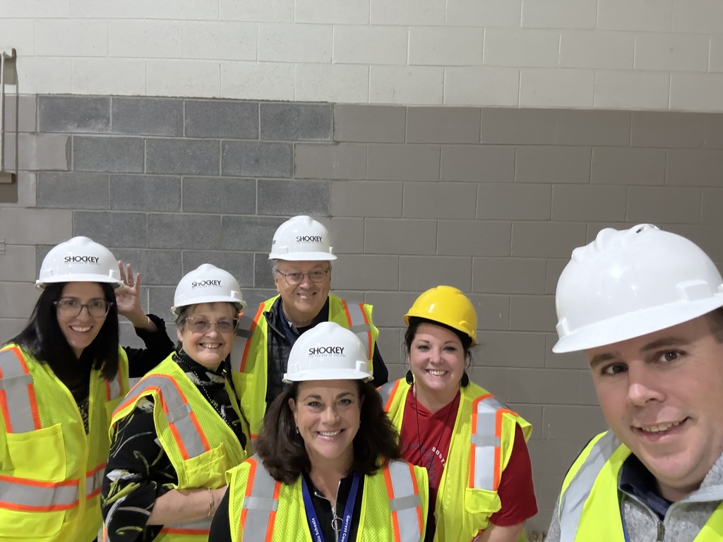 GCPS Administrators and Board Members take a selfie during their tour of the renovation progress.