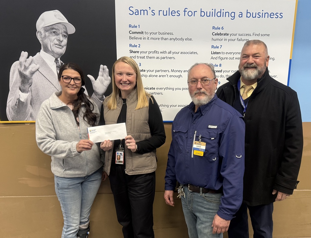 Pictured are representatives from Potomac Highlands United Way, Walmart of Oakland, and GCPS pose for a check presentation.
