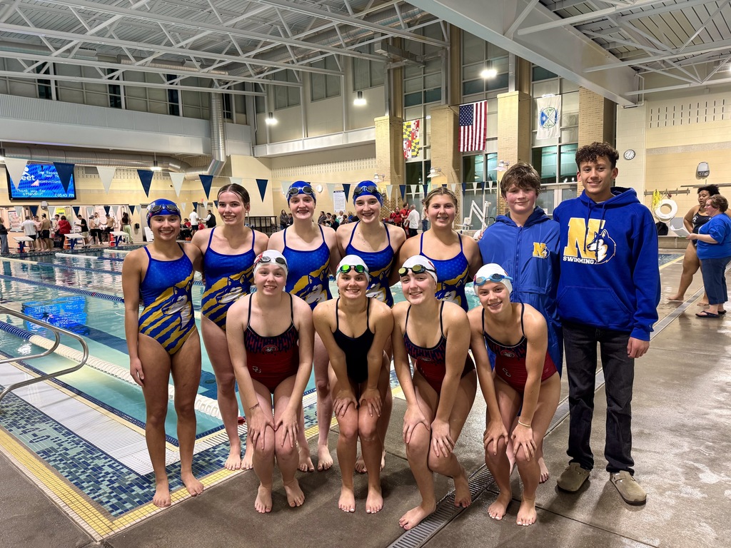 Image of swim team members of Northern and Southern Garrett High Schools pose together for a picture before the competition.