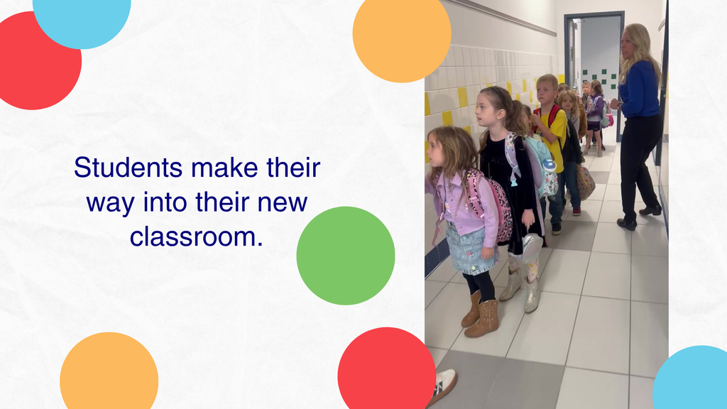 Students are walking though a hallway to their new classroom.