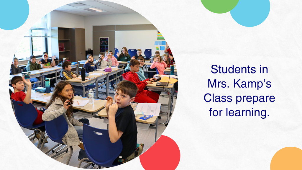 Image of students in a classroom ready to start the day.