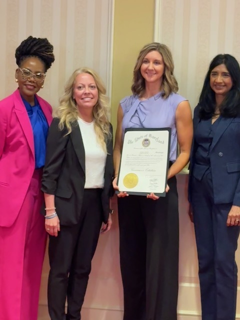 Image of Mrs. Ashby and Mrs. Fratz with state officials.