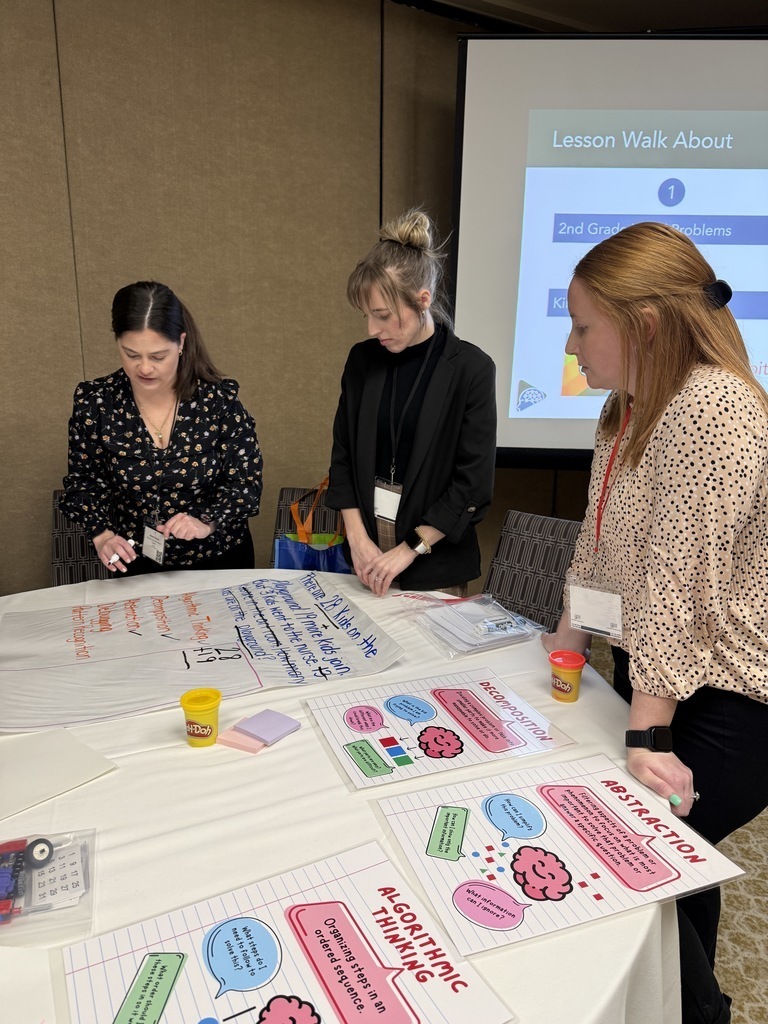 Image of Mrs. Kerns working with colleagues from across the state.