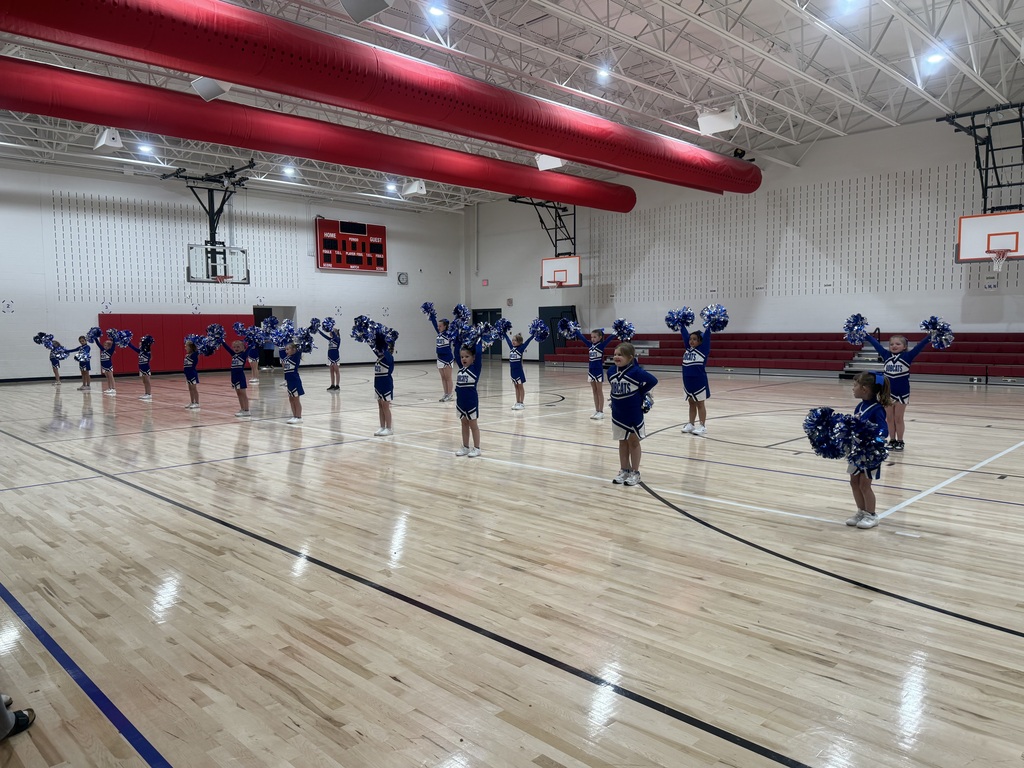 The Broad Ford School cheerleaders perform in the gym for the audience at the ribbon cutting ceremony.