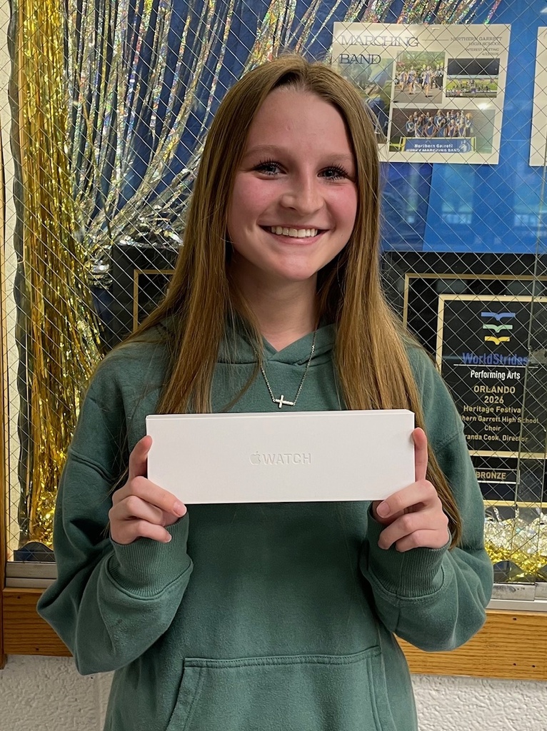 Image of Emily Beitzel holding her Apple watch.
