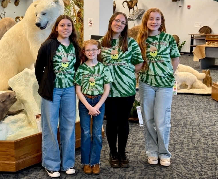Image of four members of the Bright Byte Kidz team posed together.