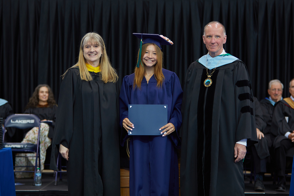 Marisa Perez was a member of the Class of 2026 at both Northern Garrett High School and Garrett College. Perez (center), is pictured with Garrett College Chief Academic Officer Christa Bowser (left) and Garrett College President Dr. Richard Midcap receiving the award for Highest Grade-Point Average at Garrett College’s 2026 commencement exercises.