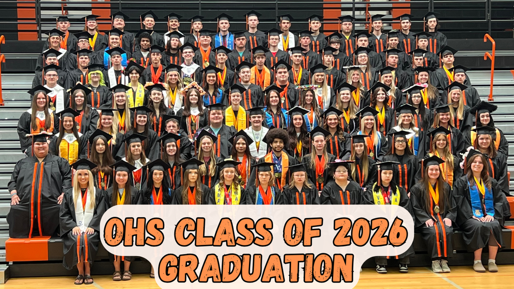 A large group of people in caps and gowns, likely at a graduation ceremony, with text overlay reading "OHS Class of 2026 Graduation."