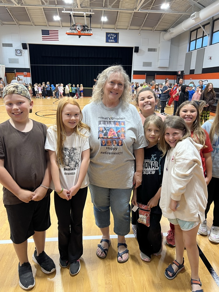 Photo of staff and students celebrating a staff members retirement.