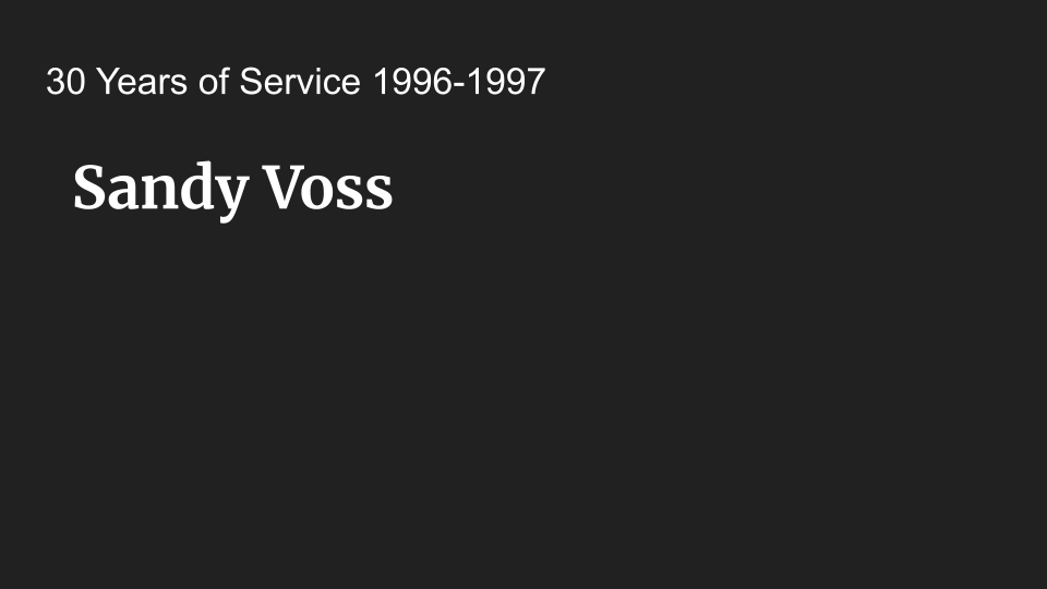 A black background displays white text reading "30 Years of Service 1996-1997 Sandy Voss" in a centered position.