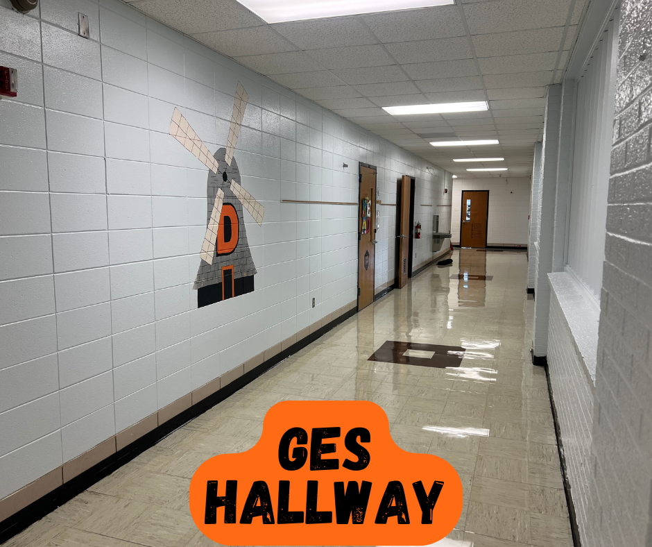Empty school hallway with a windmill drawing on the wall and the words "GES HALLWAY" in orange.