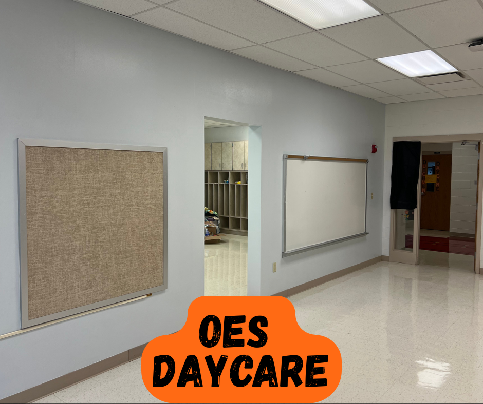Empty room with white walls, floor, and ceiling. A bulletin board and whiteboard are on the wall.