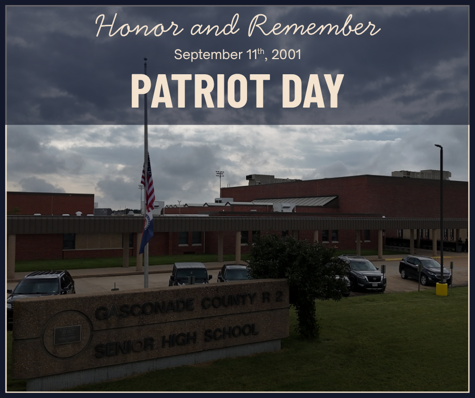 A school building with a flagpole in the foreground. "Patriot Day" is written on the top.