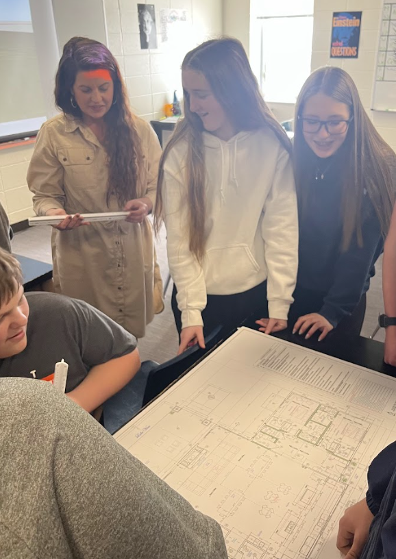 Student viewing blue print