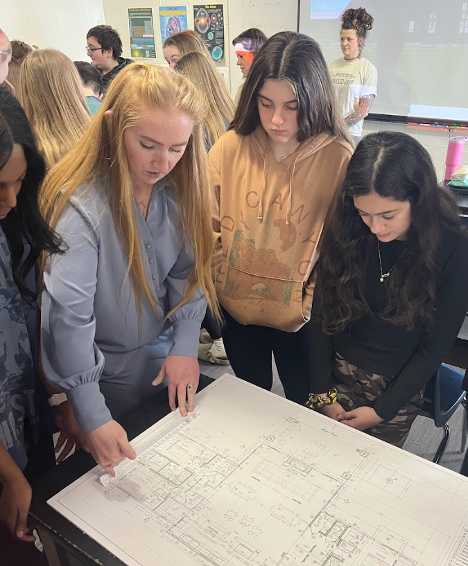 Student viewing blue print