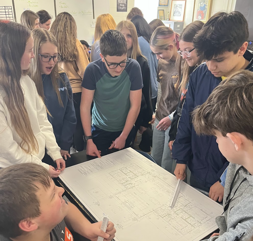 Student viewing blue print