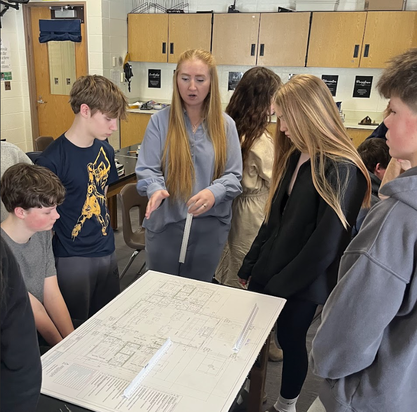 Student viewing blue print