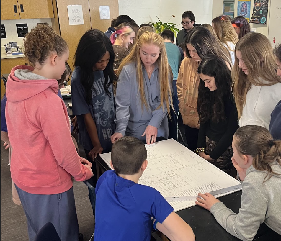 Student viewing blue print