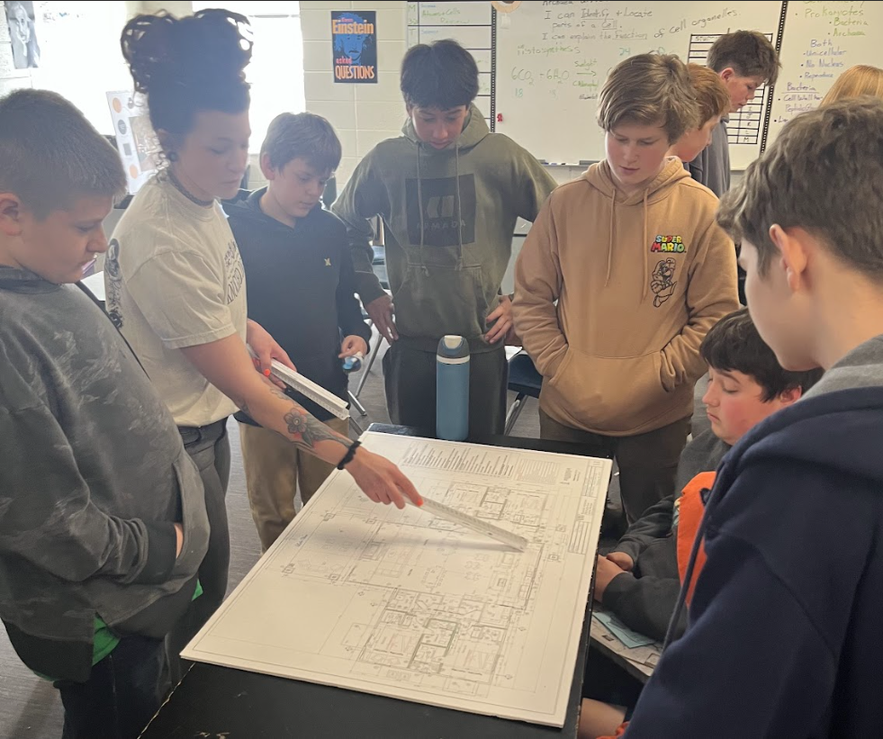 Student viewing blue print