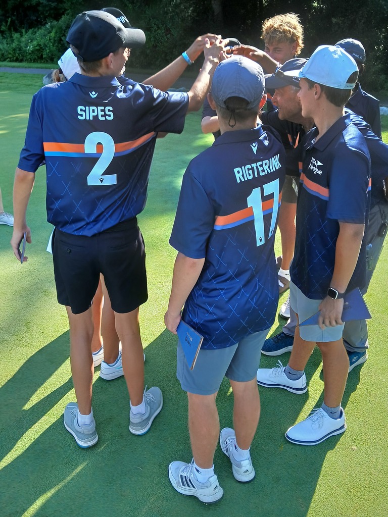 Picture of team meeting together for a cheer. 