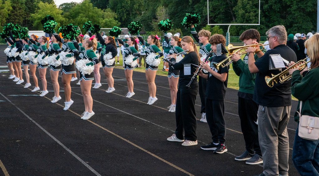 Playing the fight song and cheering