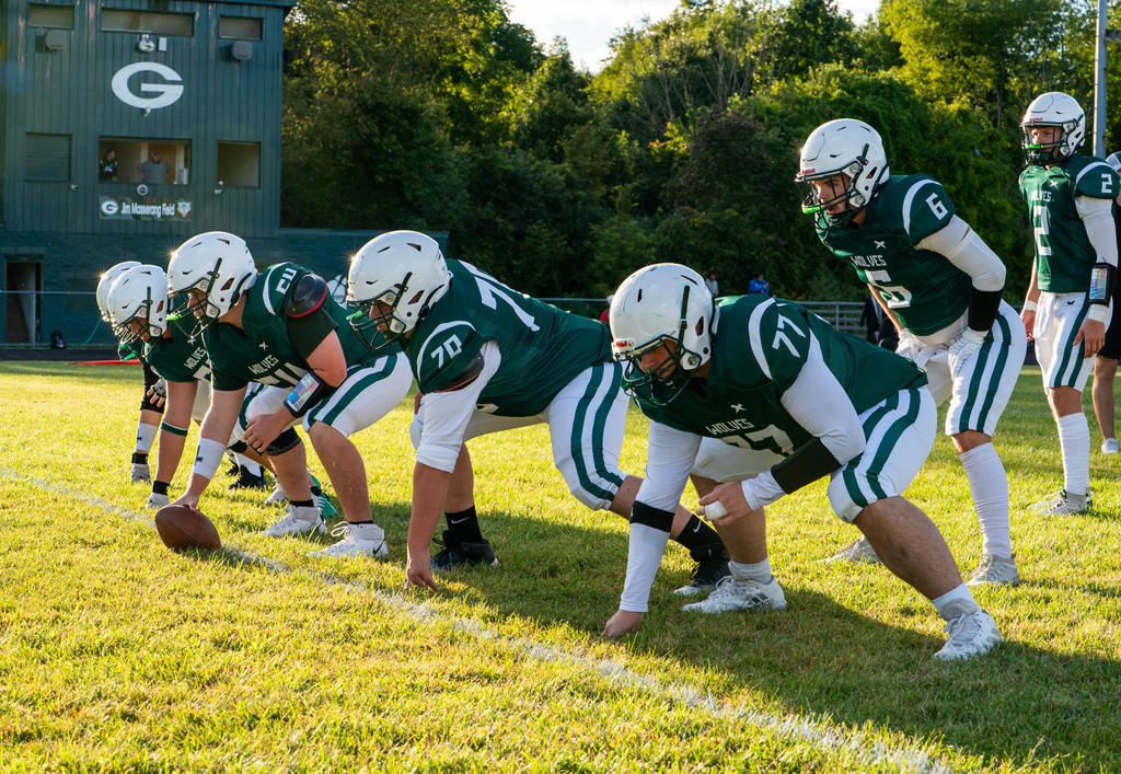 Practicing before the game with pressbox in background