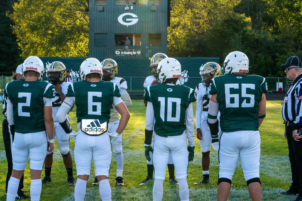 Captains lining up for coin flip