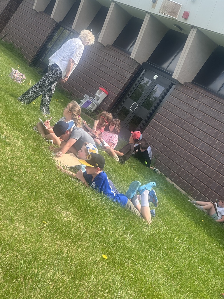 Second graders recently took advantage of the beautiful weather and brought their writing class outside! ☀️✏️ They were hard at work writing letters as we continue trying to solve the mystery of who their pen pal might be! The excitement and curiosity are growing with every letter they send!