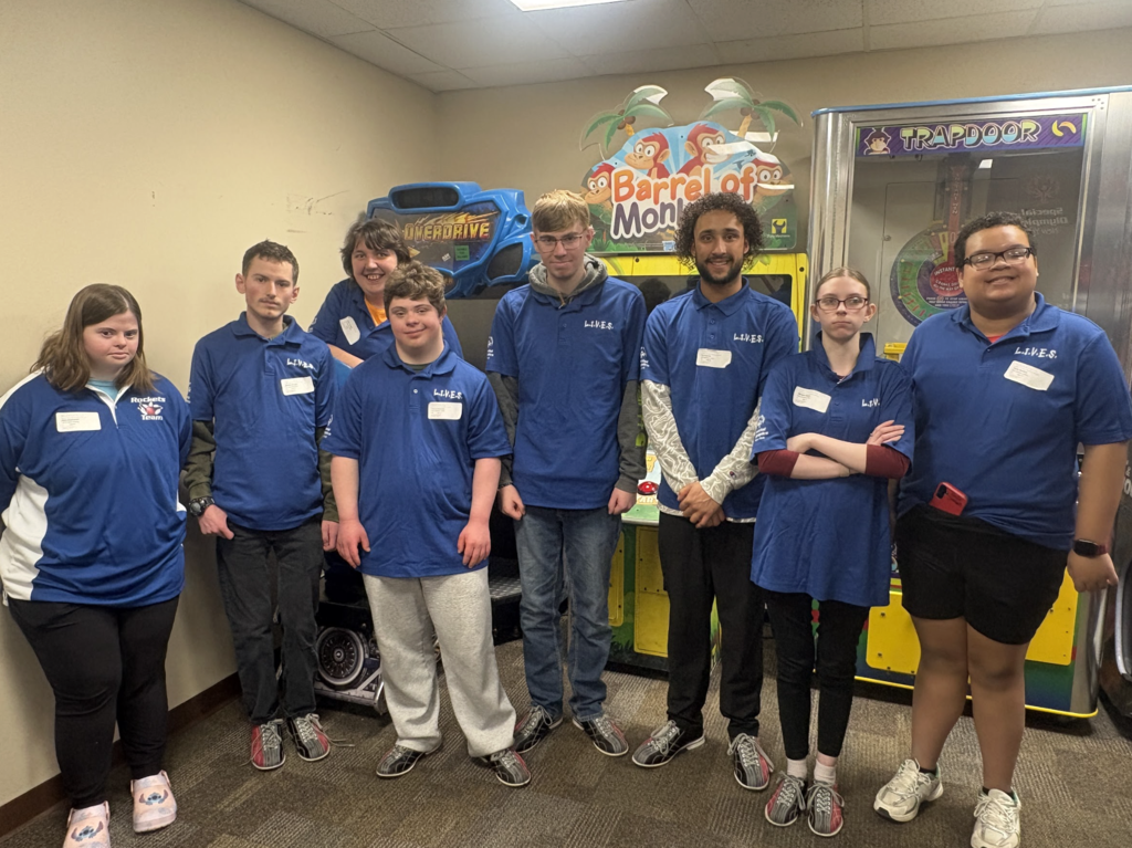 Eight students from our LIVES program pose for a picture after bowling.  