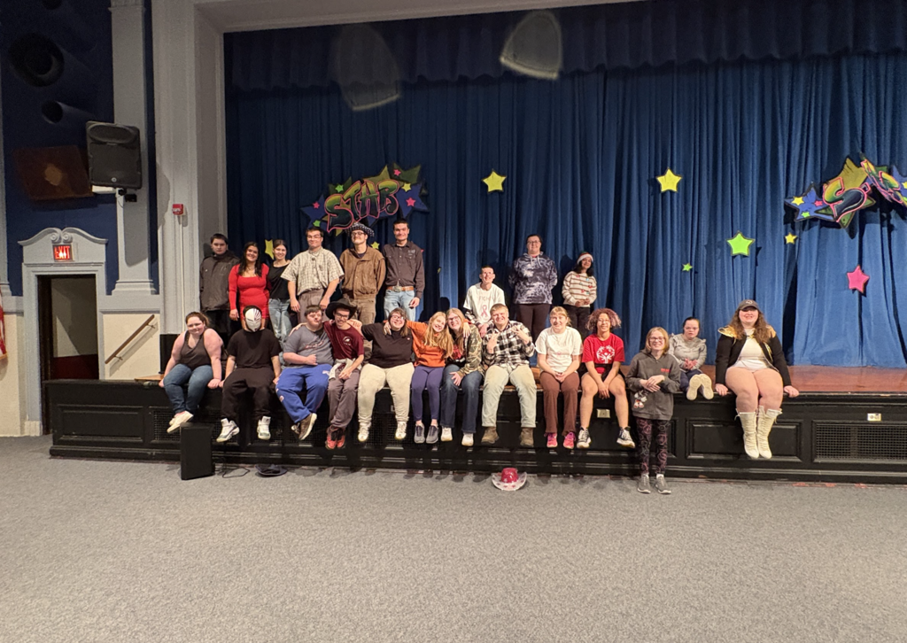Dansville Students pose on stage after performing in the talent show.