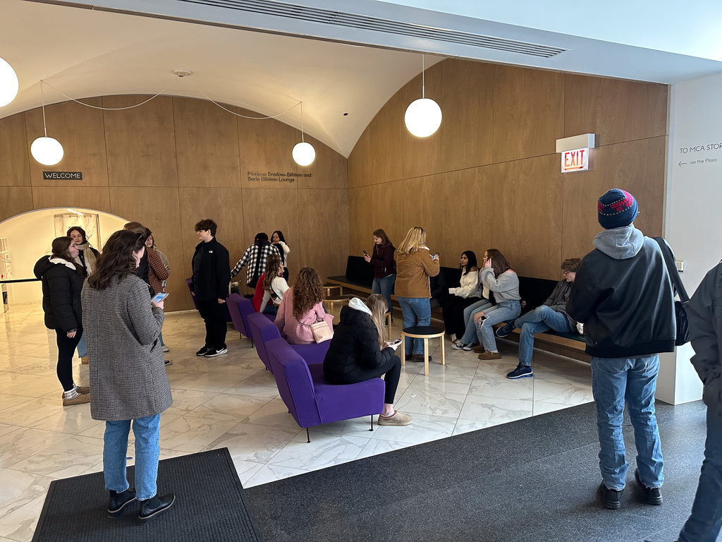students waiting in lobby