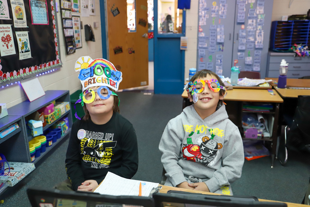 students wearing 100 day hats and glasses