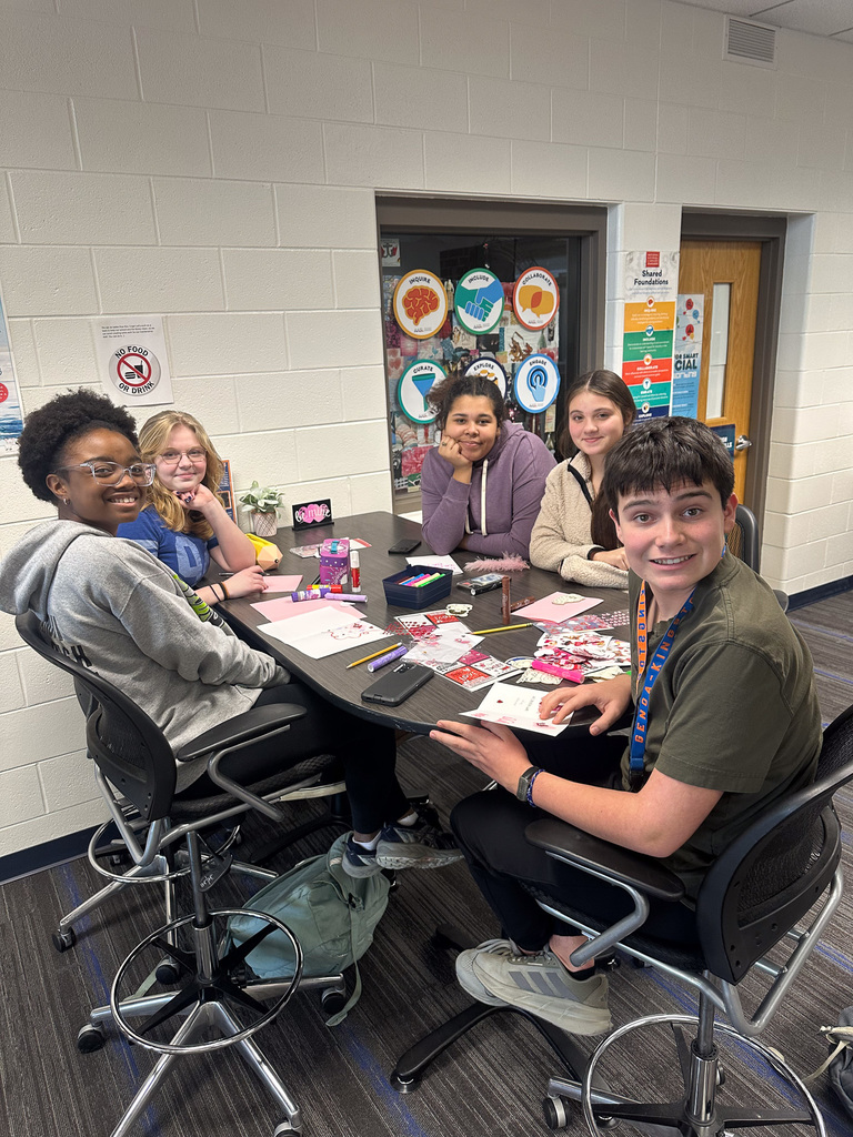 students working on valentine day cards