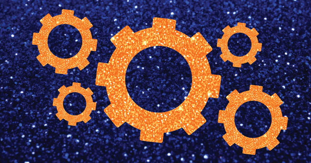 Orange glitter cogs over a blue glitter background