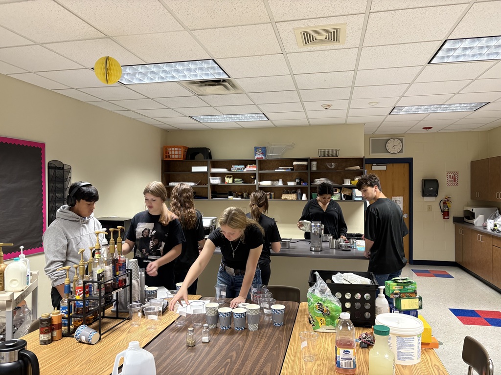 students making coffee for staff