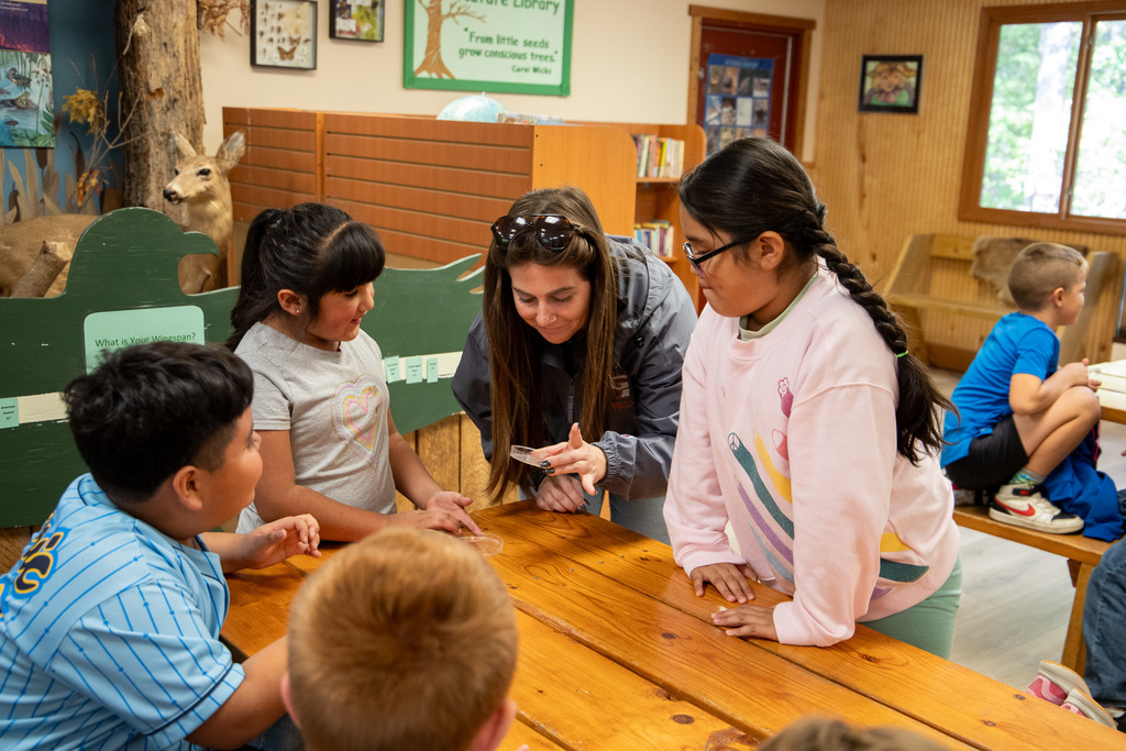 students holding worms